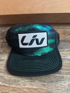 Liv Logo Trucker Hat in Black & Teal